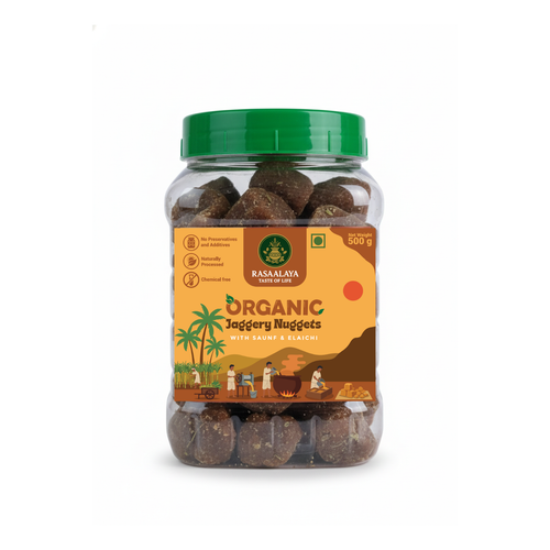 Jar of organic jaggery nuggets with a green lid on a white background